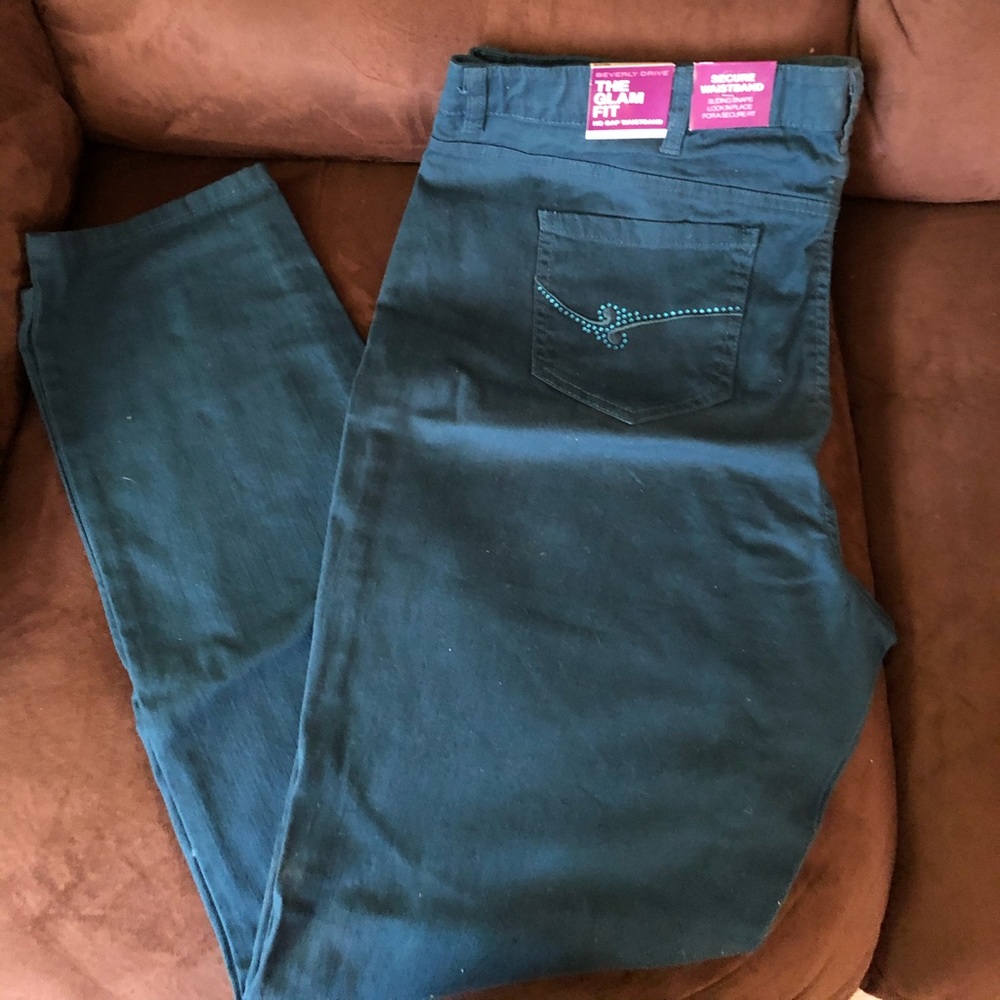 Teal colored 5 pocket zip front jeans size 20